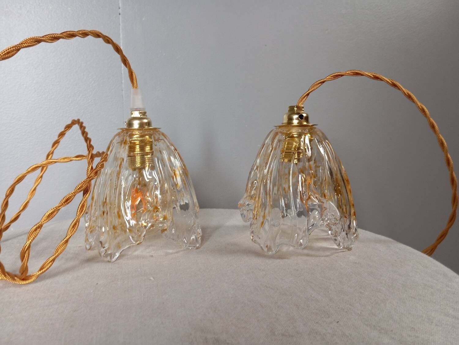 Pair of draped blown glass hanging lamps, ocher twisted wire