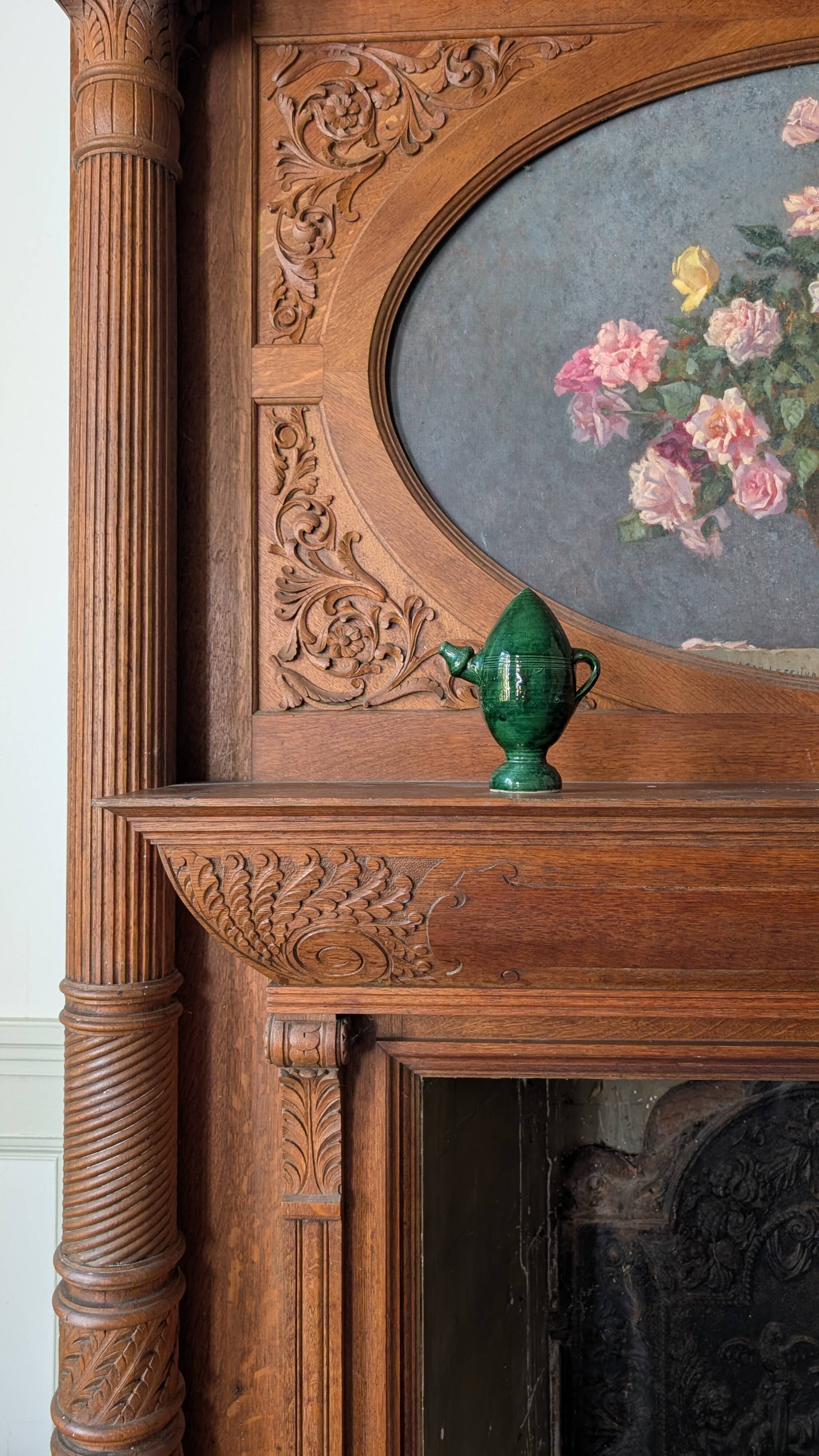 Decorative piece in green glazed stoneware, jug shape.