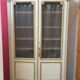 Bookcase 2 painted in ochre and cream mesh doors beginning 20 th