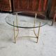 Table basse plateau verre rond et pieds laiton