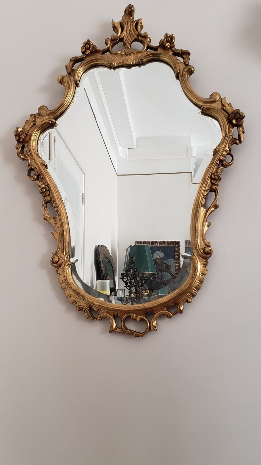 Beveled mirror and gilded wood