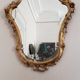 Beveled mirror and gilded wood