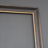 Large wooden black and gilded frame