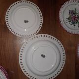 7 openwork plates and the Lunéville earthenware cake dish known as “semi Luneville porcelain”.