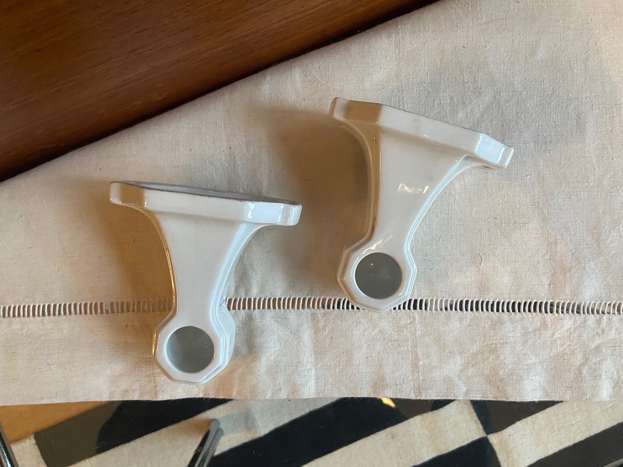 Pair of white earthenware wall candlesticks