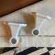 Pair of white earthenware wall candlesticks