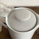 Porcelain teapot with hand-painted bird decoration