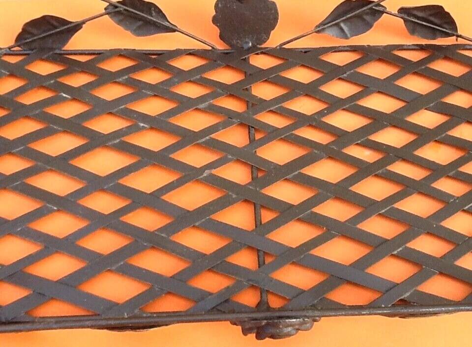 Rectangular metal serving tray with floral decoration.