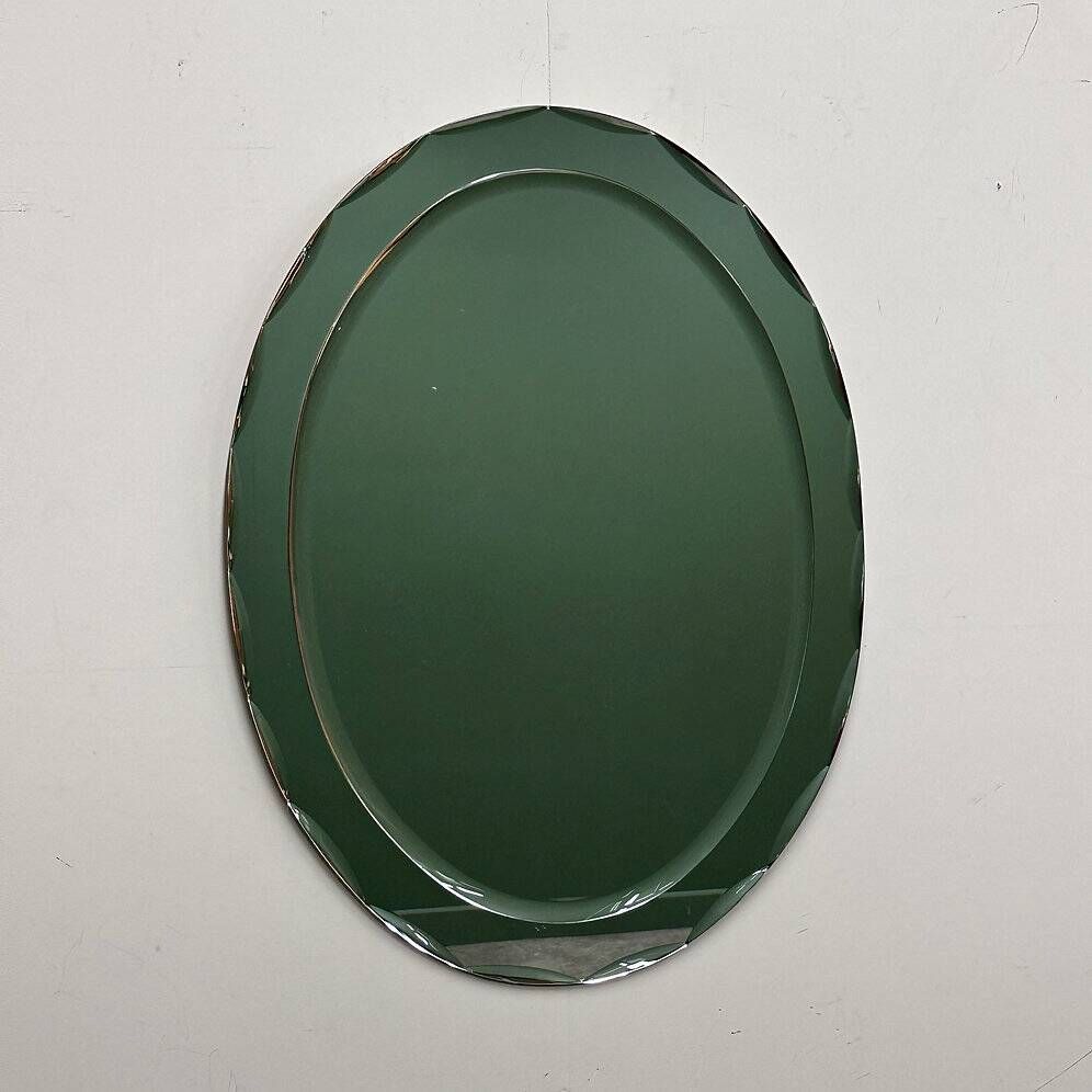 1970s Italian oval mirror by Crystal Arte with faceted glass frame