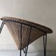 Italian sunflowers armchair in rattan and black metal, 1950s design.