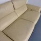 Two-seater designer sofa De Sede DS-2011 in cream leather with adjustable backrest.