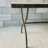 Table made of wrought iron and cement