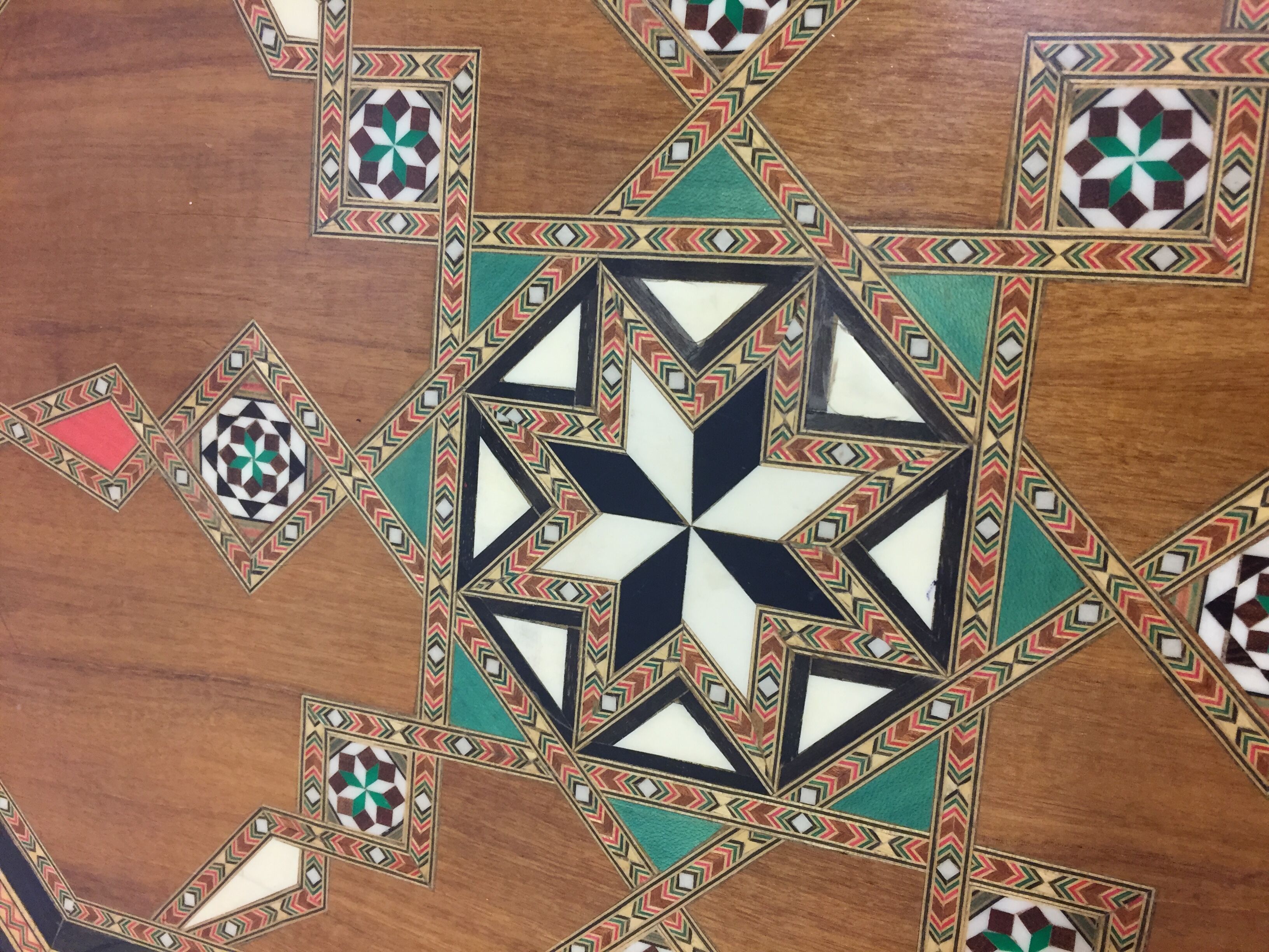 Old geometric marquetry top design'