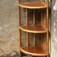 Varnished rattan corner shelf
