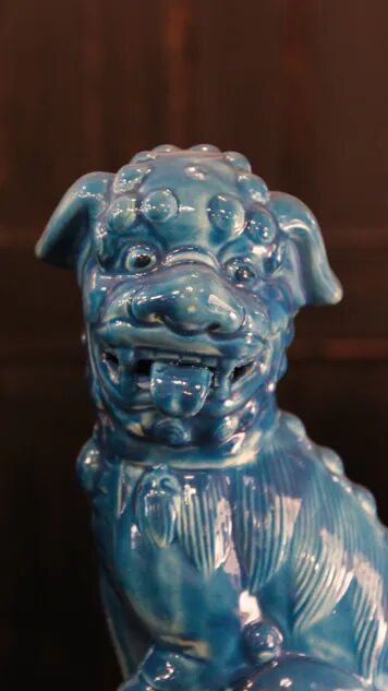 Pair of Foo dog bookends in turquoise glazed ceramic, Manises
