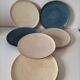Set of 6 cream and grey-blue glazed earthenware plates.