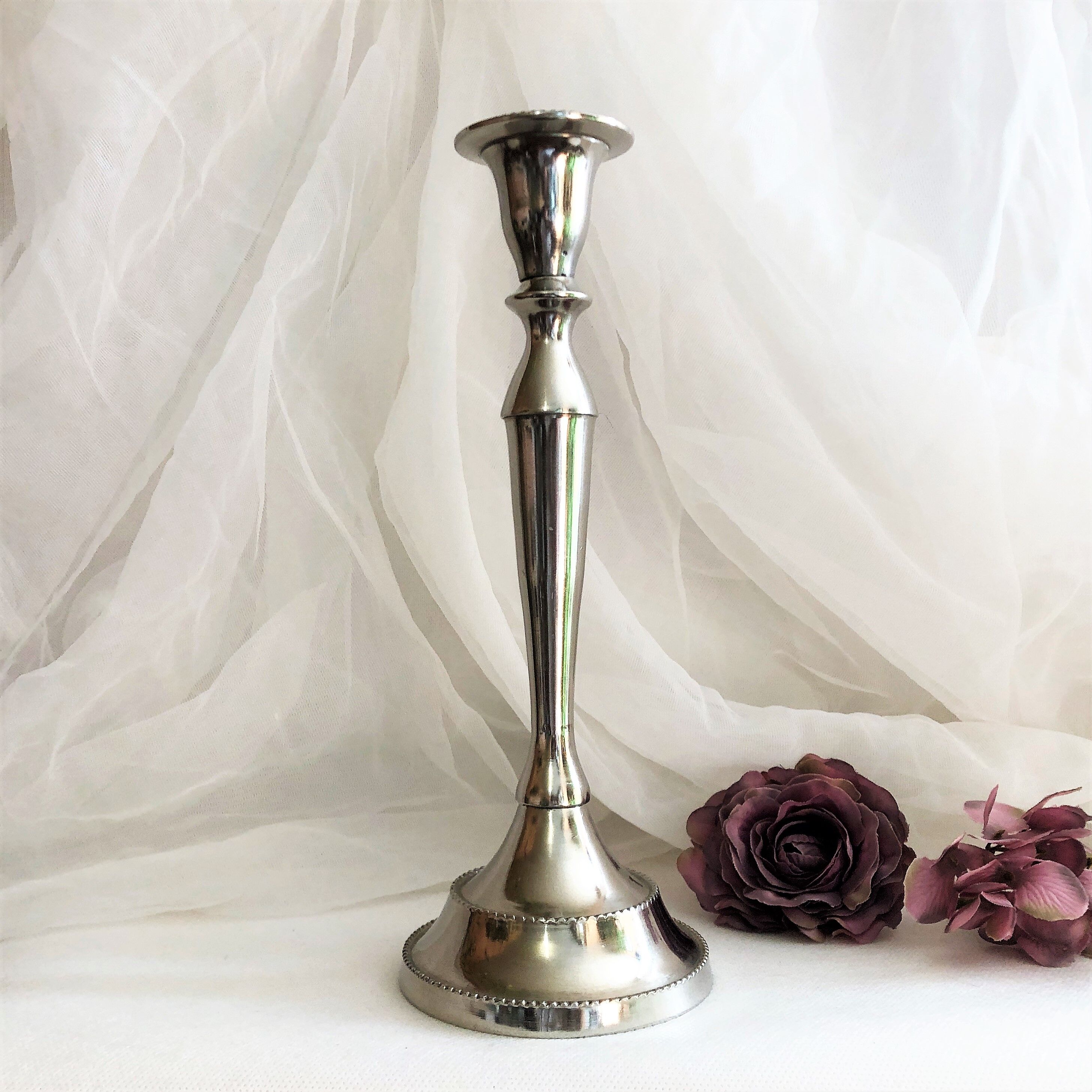 Chromed metal candle holder