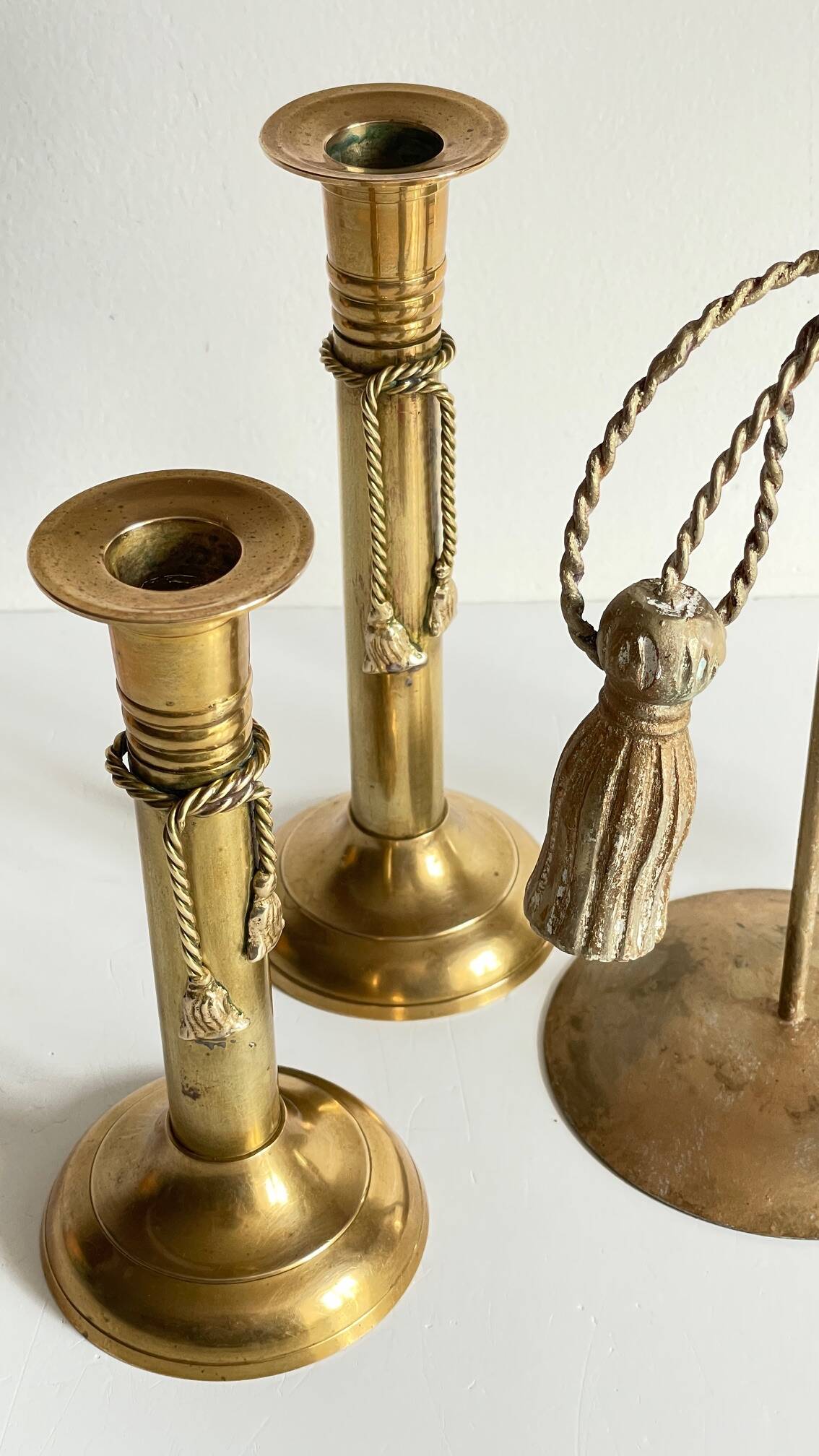 Trio of vintage knotted candlesticks brass