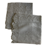 Pair of 19th century linen thread pillowcases embroidered with scallops