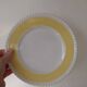 Vintage yellow butter ceramic dinnerware set with swirl border.