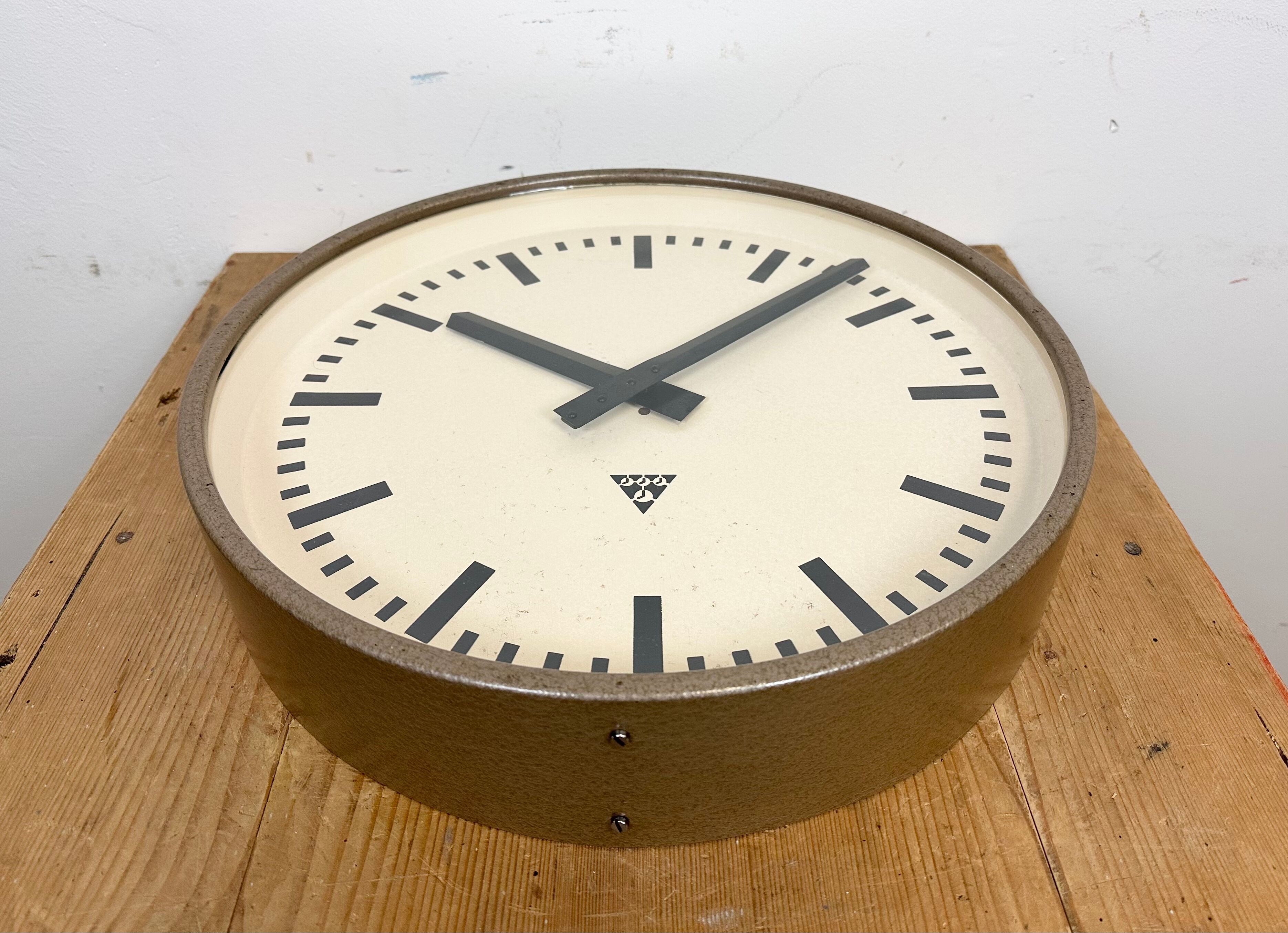 Brown industrial factory wall clock from Pragotron, 1960s