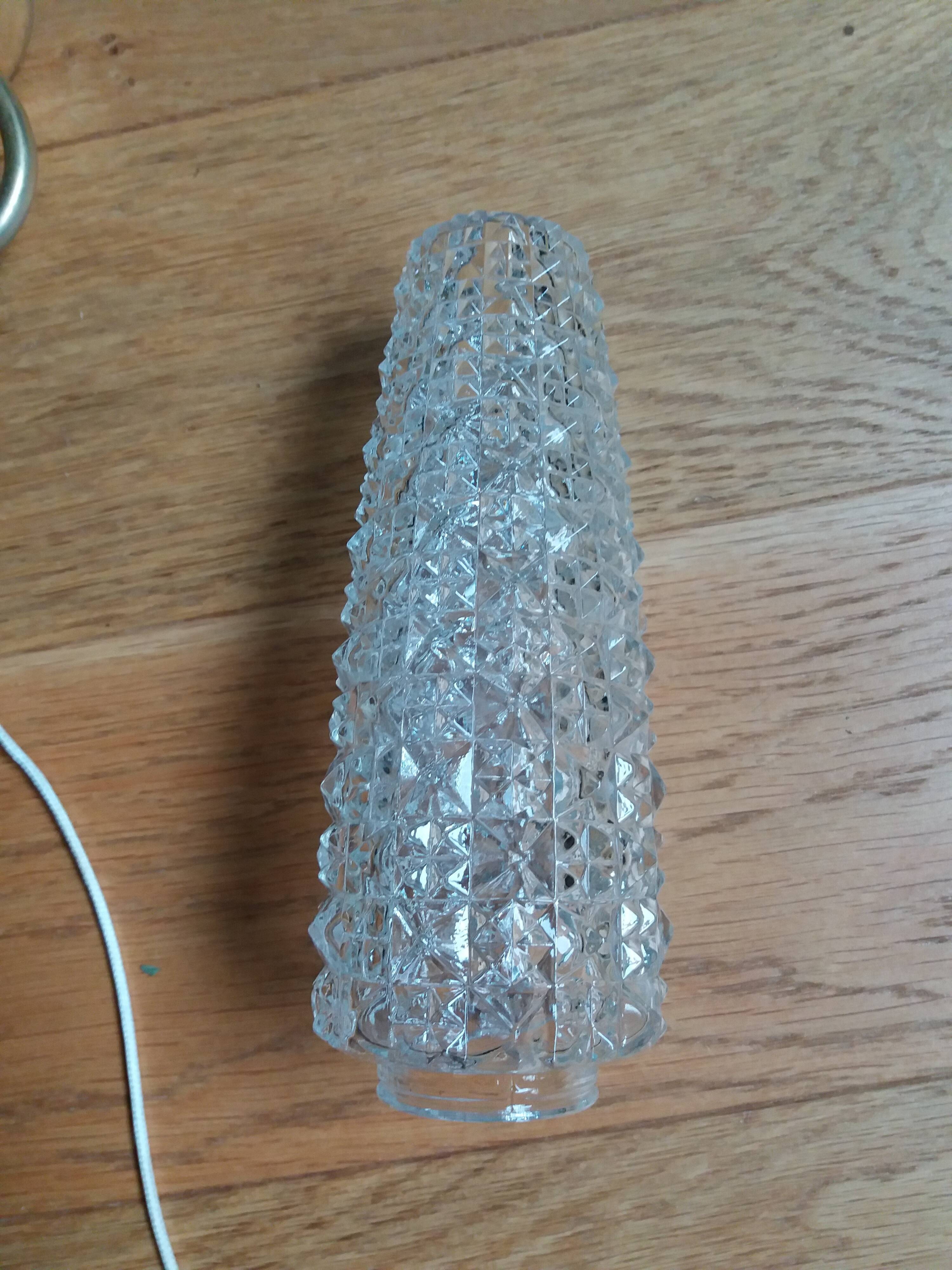 Brass wall lamp and pineapple glass