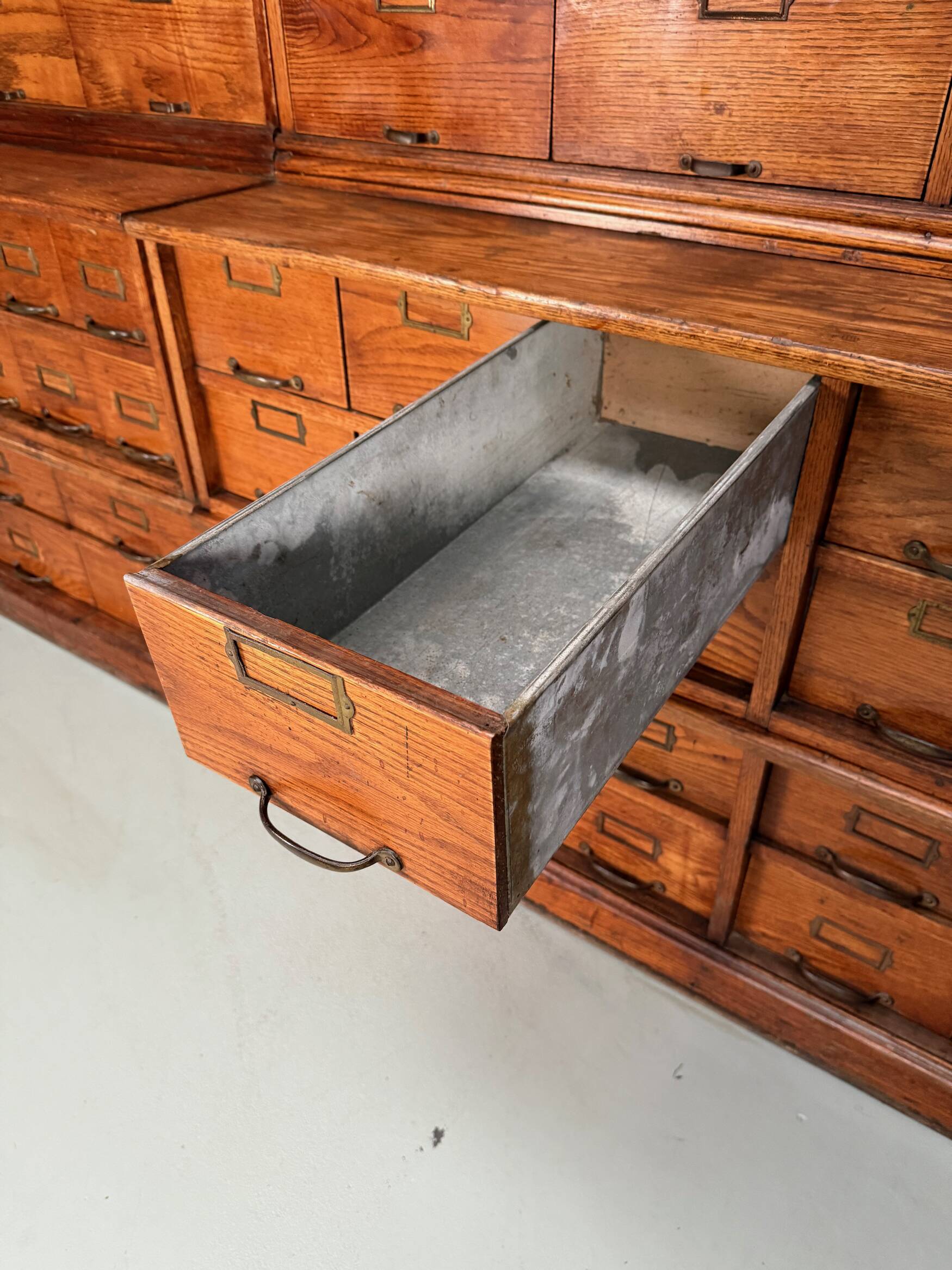 Antique very large American oak grain / apothecary cabinet, ca 1900