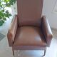 a pair of comfortable vintage armchairs with splayed legs