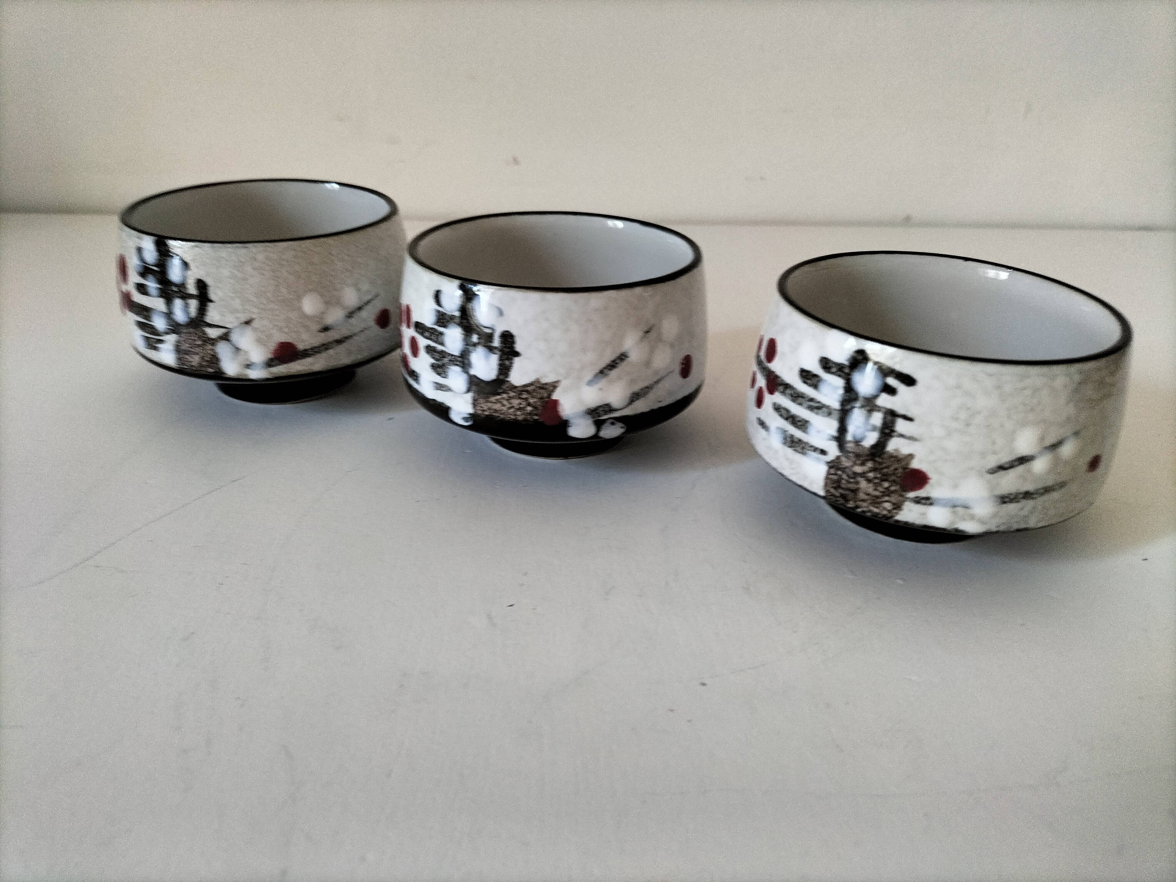 Three glazed ceramic bowls with raised graphic decoration, 1970s.