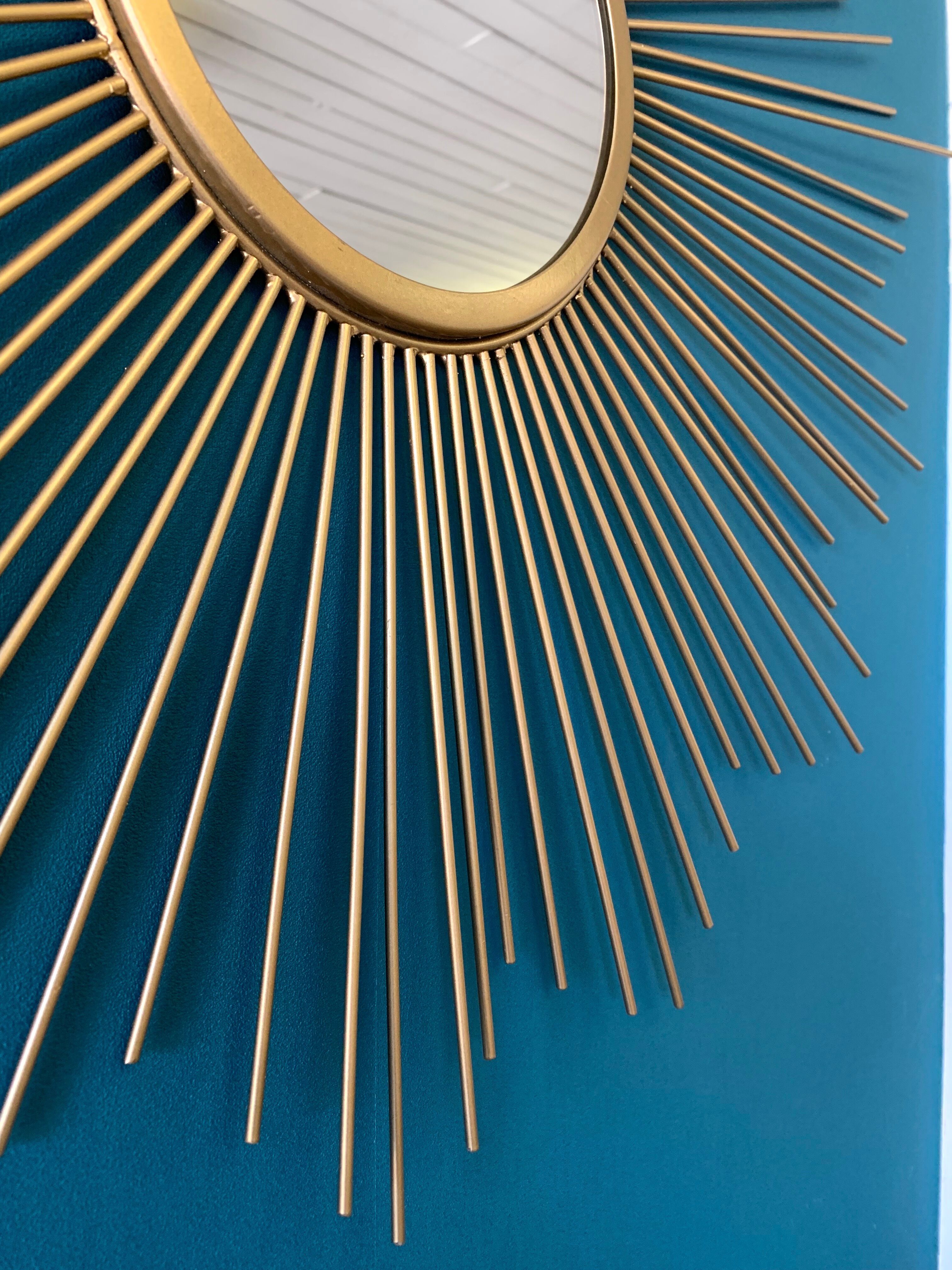 Sun mirror in gilded metal