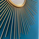 Sun mirror in gilded metal