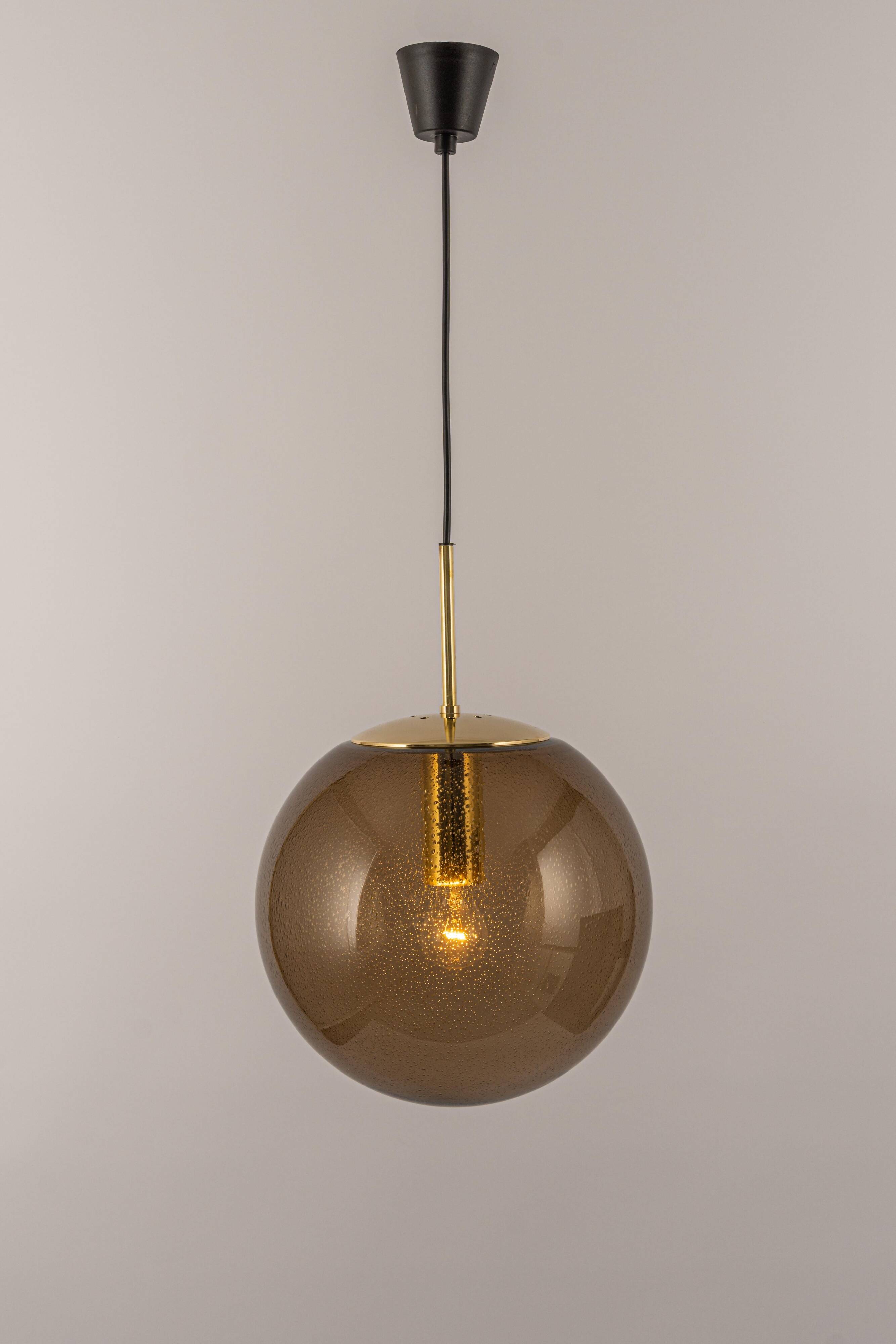 Large smoked glass ball pendant by Limburg with brass, Germany, 1970s.