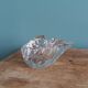 Shell-shaped crystal paperweight.