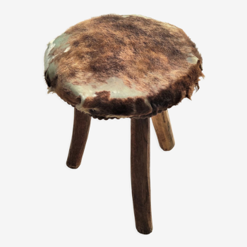 Rustic tripod stool goat skin covered seat with seat reinforcements
