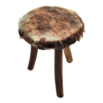 Rustic tripod stool goat skin covered seat with seat reinforcements