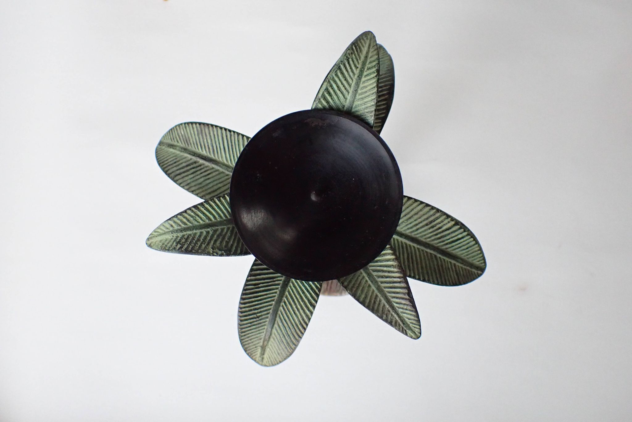 Antique palm tree-shaped candlestick in patinated metal