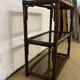 Rattan and smoked glass bookcase shelf