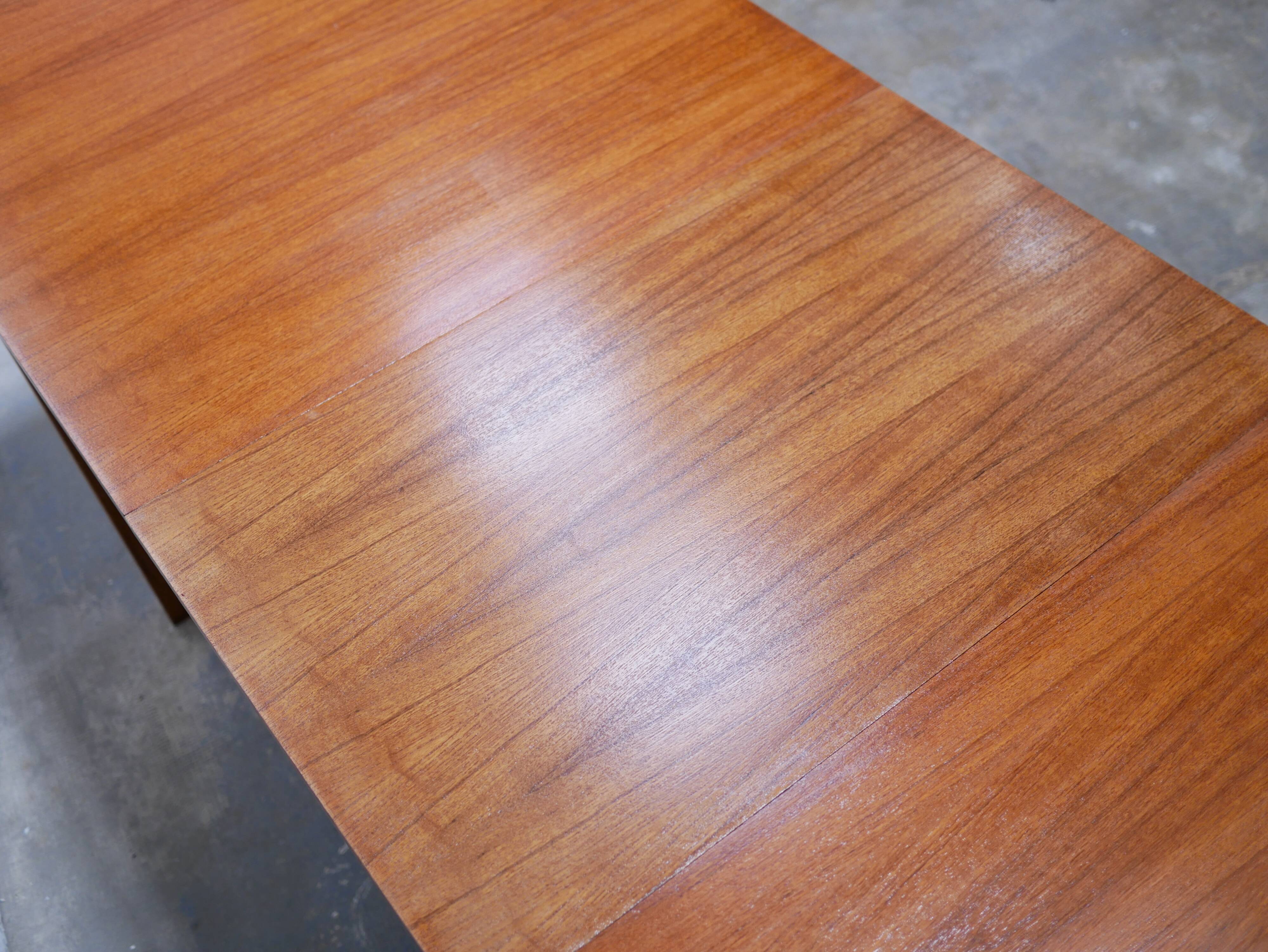 Extendable teak dining table by Gérard Guermonprez for Magnani editions