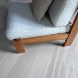 Vintage wooden armchair with curly seat