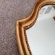Vintage baroque mirror in gilded wood in the Louis XV style.