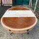 Round extendable table in Empire style, renovated with Bordeaux leather and raw wood, 168cm.