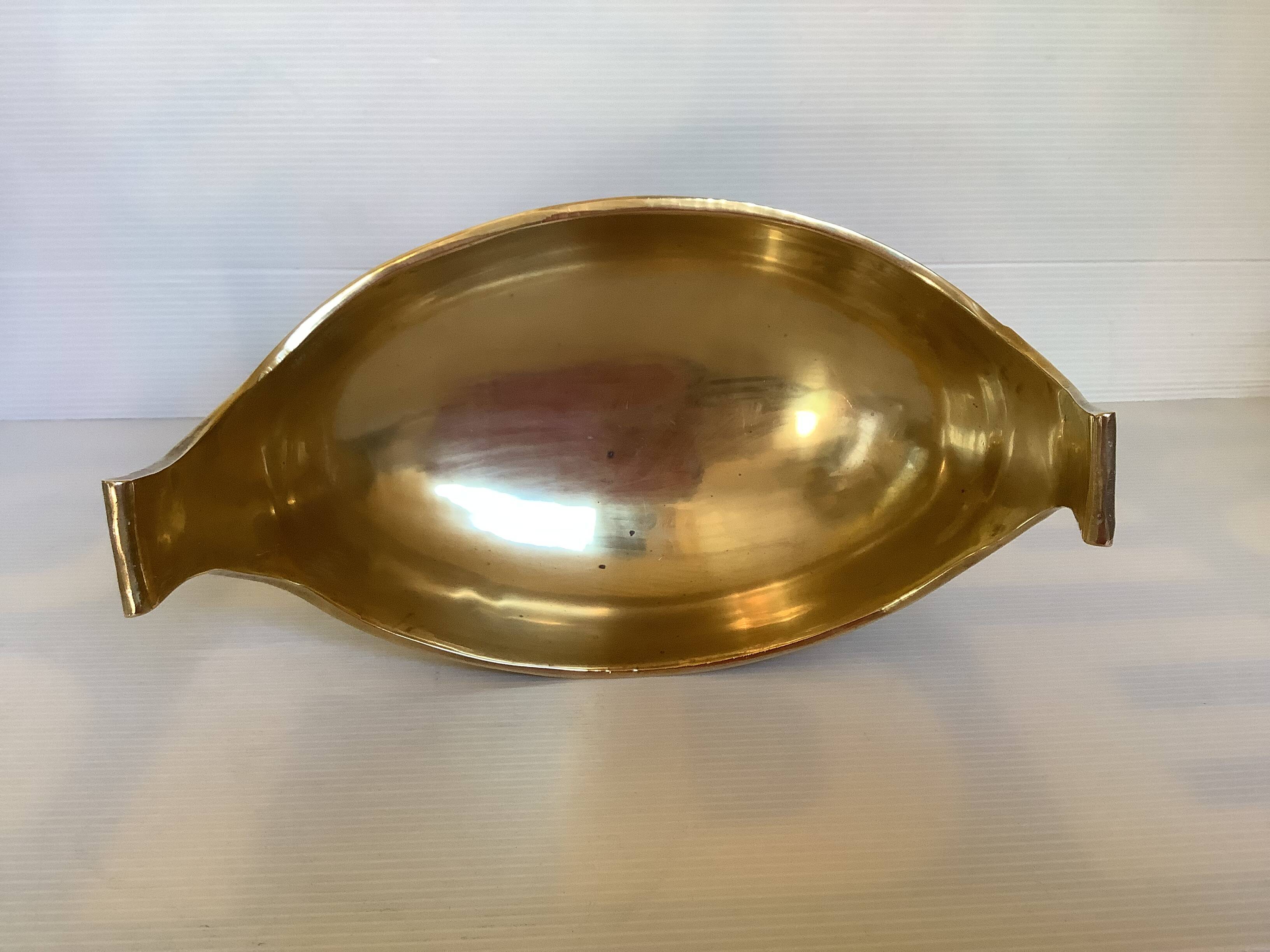 Brass cup emptier