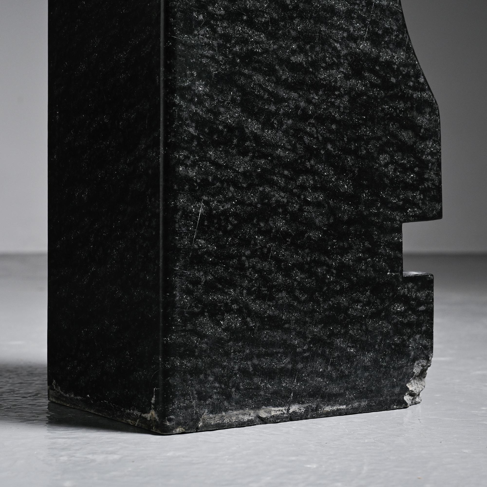 Abstract sculpture in diabase by Robert Neuhauser, Switzerland, circa 1985.
