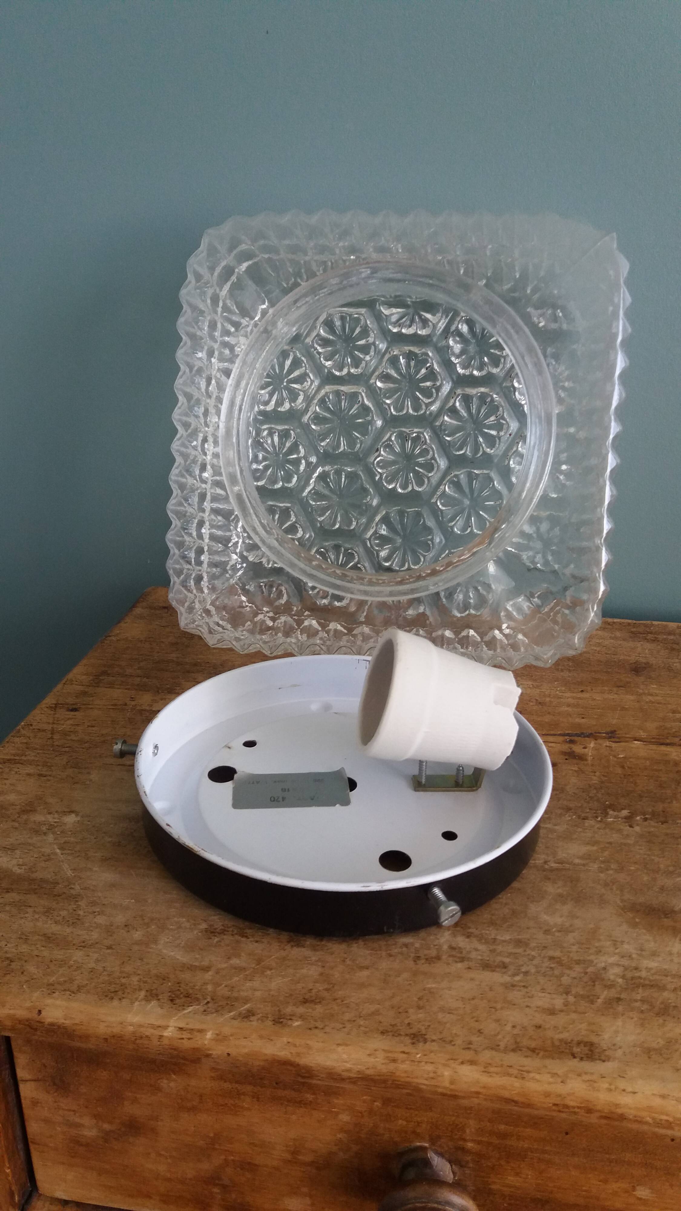 Square globe ceiling light in moulded glass.