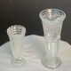 Set of two large, vintage, clear, molded glass vases on feet