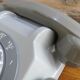 Grey vintage rotary dial phone with earpiece