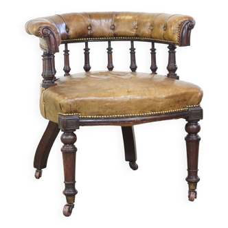 Antique English cowhide leather armchair/office chair combined with wood on original wheels