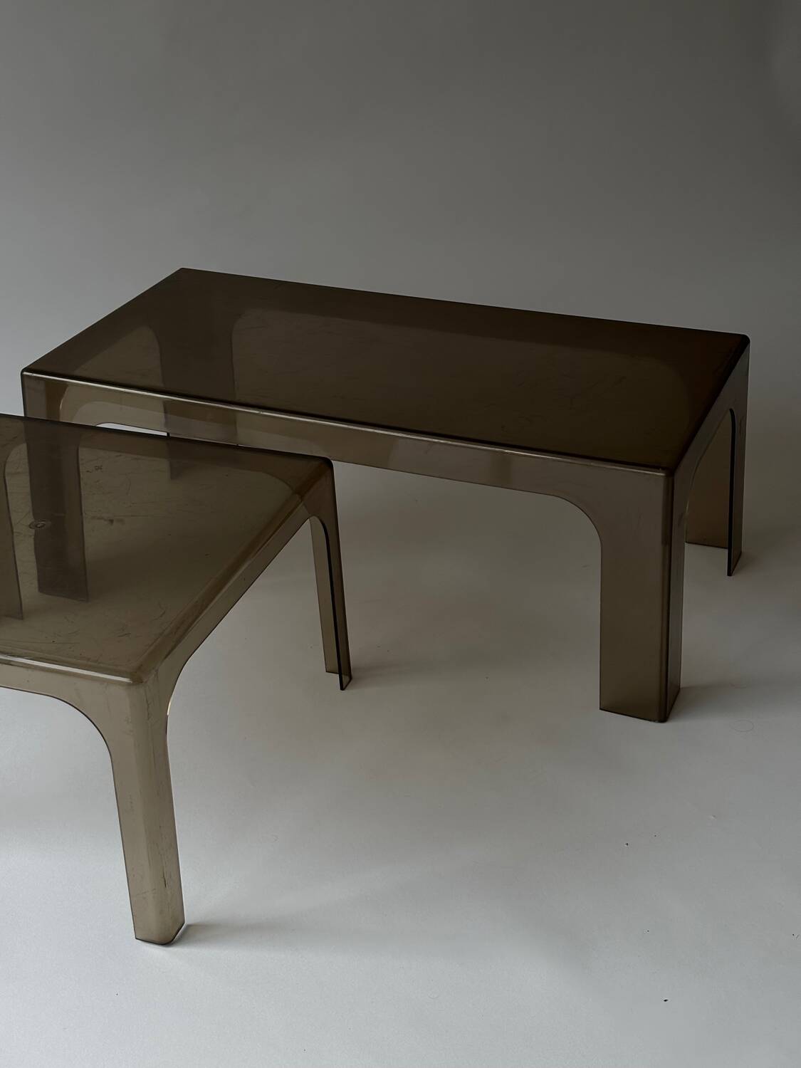Smoked plastic coffee tables 1970