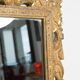 Decorative gold mirror mid-century in a wooden frame, Italy, 1960s.