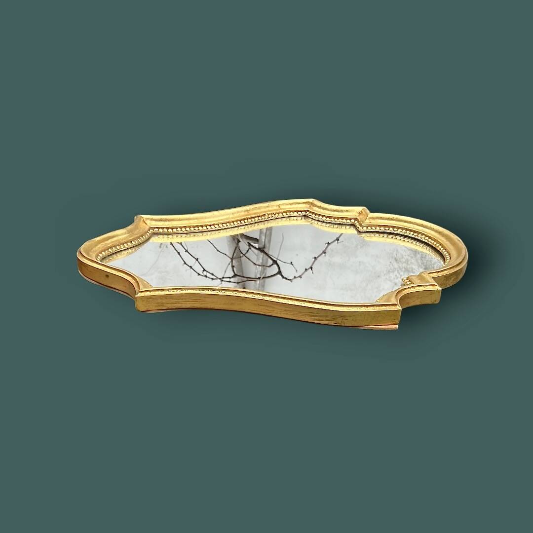 Antique mirror in gilded resin, shaped with curves – neoclassical style